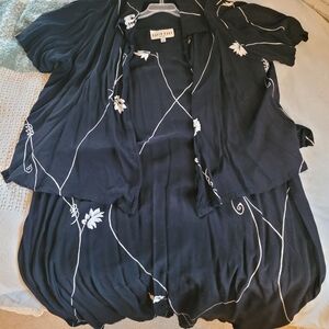 Elegant Black Blouse with White Floral Accents